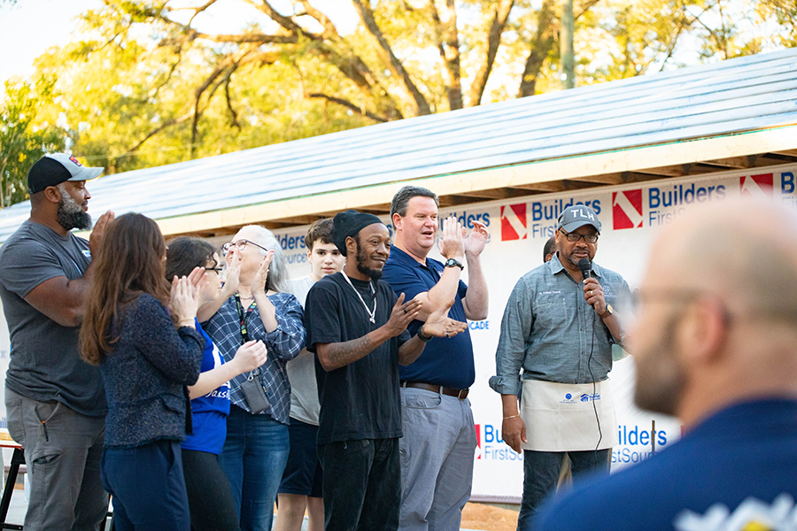 Officials and citizens applaud at the event