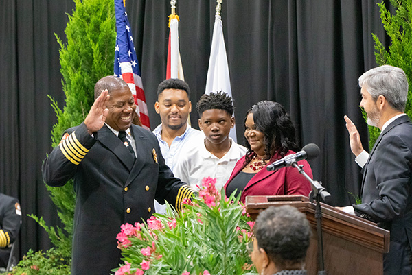 Chief Sanders being sworn in with his family