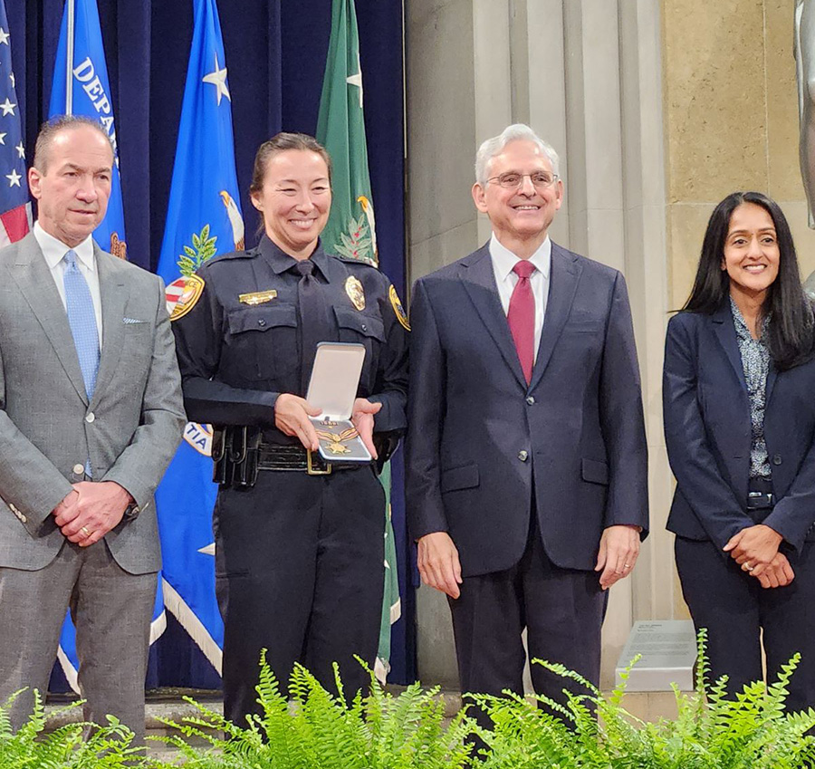 Officer Hamby with the Attorney General and others